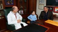 doctor with patient and family member